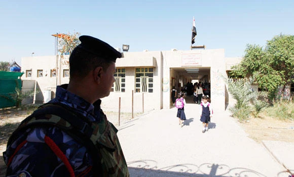 Iraq schools open a month late amid crowding by the displaced
