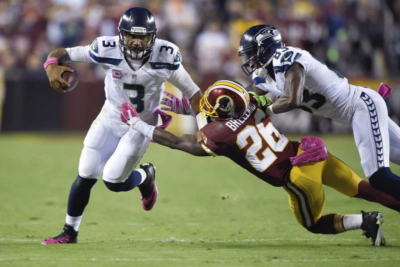 Wilson fires penalty-prone Seahawks past Redskins