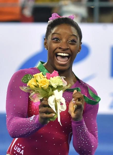 American Biles retains world all-around gym title