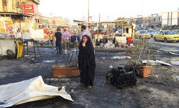 Suicide bomber kills 19 outside Baghdad mosque