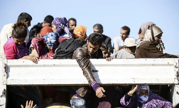 IS militants behead captured Kurds; UK warns citizens