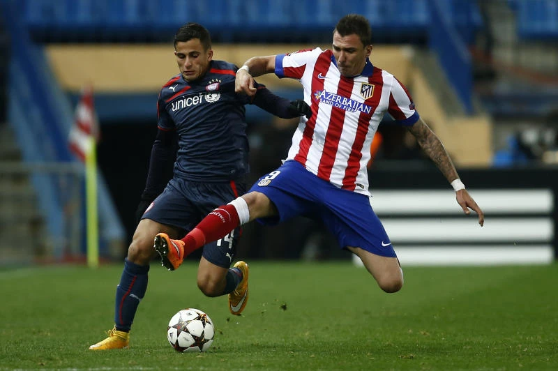 Atletico Madrid, Arsenal reach Champions League knockout phase