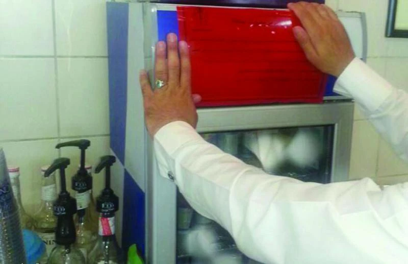 Warning signs placed on EP energy drink fridges