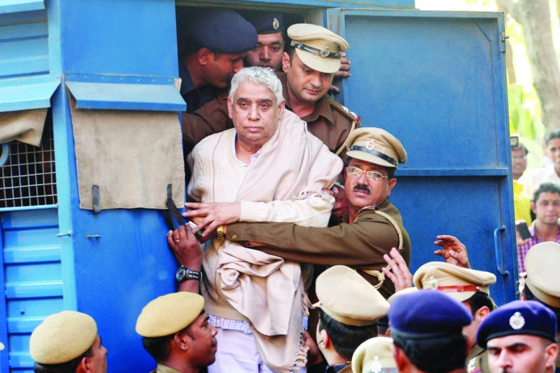 Indian police search ashram for explosives after bloody standoff