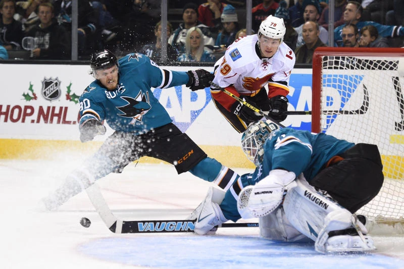 Ramo makes 32 saves to lead Flames past Sharks 2-0