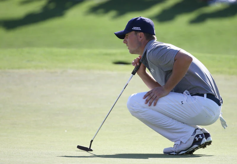 Spieth shares lead as McIlroy implodes in Sydney