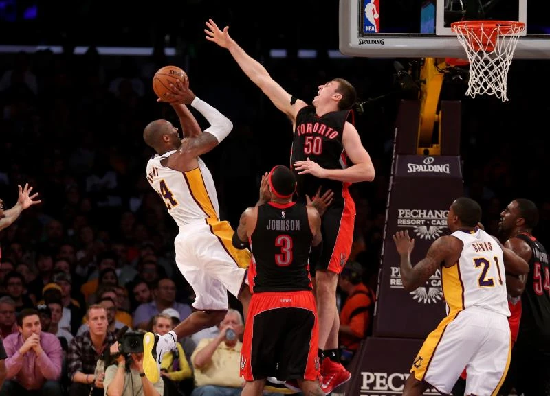 Bryant posts triple-double as Lakers beat Raptors in OT