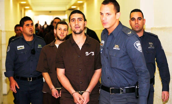 Three Israelis charged with torching school