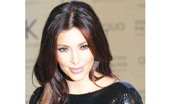 Kim photoshops pic to look slim