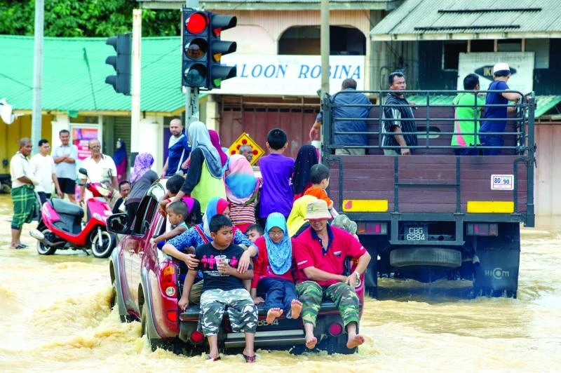 Rescuers struggle to reach flood victims in Malaysia