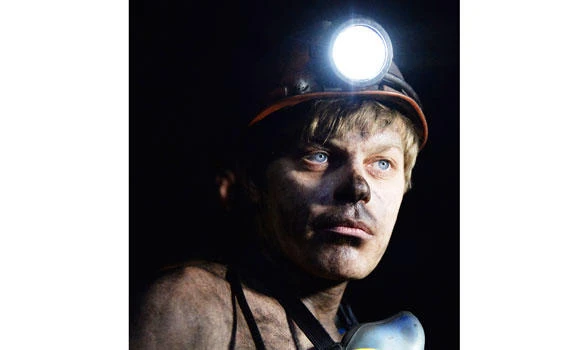 Deep under rebel-held east Ukraine, miners work on