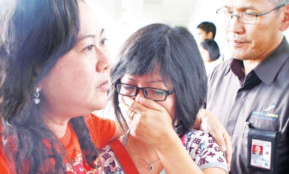 Devastated families of 162 fliers await news