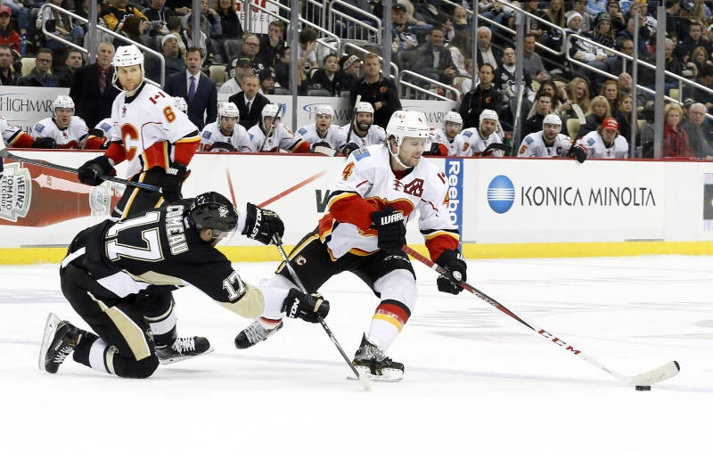 Penguins get past Flames yet again, top NHL East