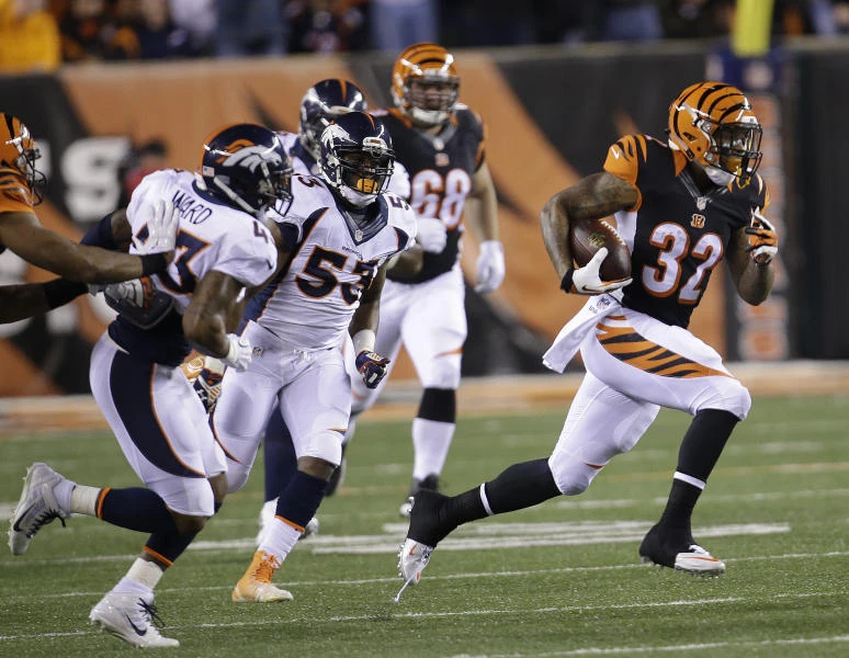 Bengals punish sloppy Manning to clinch playoff spot
