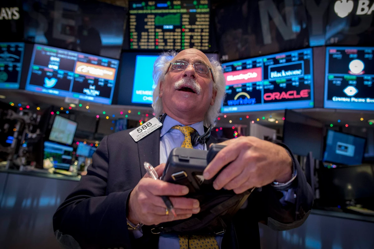 Stocks climb on Fed policy signals