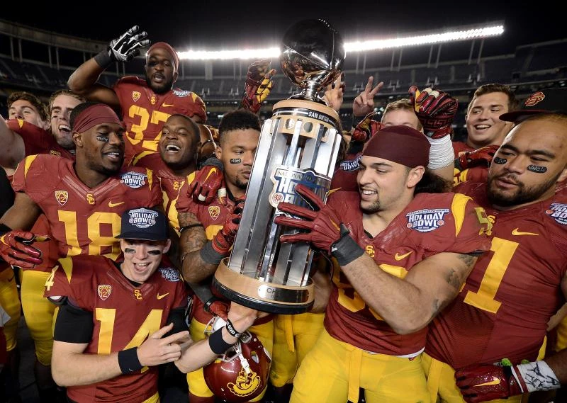 Trojans hang on to edge Huskers in Holiday Bowl