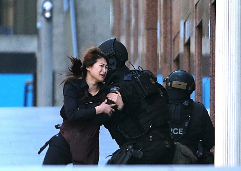 Two killed as Australian police storm siege cafe