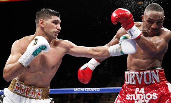 Boxing champ Khan visits Pakistan massacre school