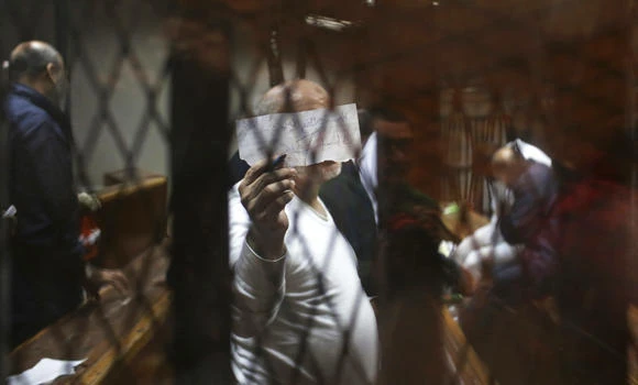 Egypt jails 40 Mursi men for church fires