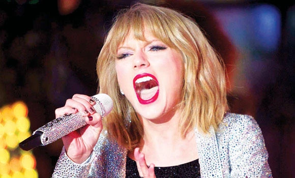 NYC celebrates 2015 with Taylor Swift and a big ball