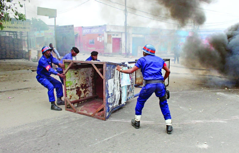 Police, protesters face off in DR Congo over election law