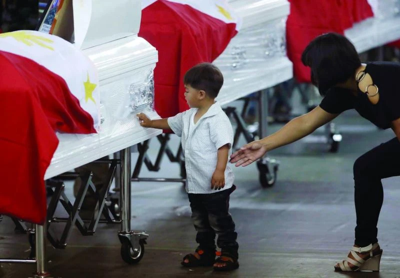 Aquino vows justice for 44 policemen killed in violence
