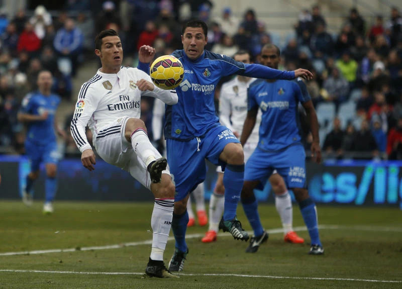 Ronaldo double takes Madrid four points clear