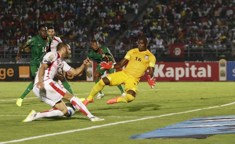 Troubled Tunisia tops table with dramatic win