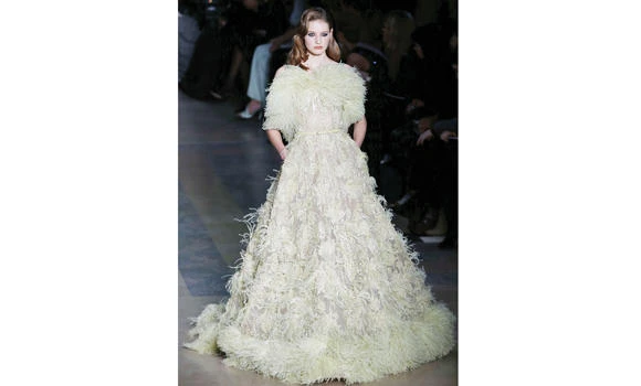 Campbell steals show at couture as Bruni is mobbed