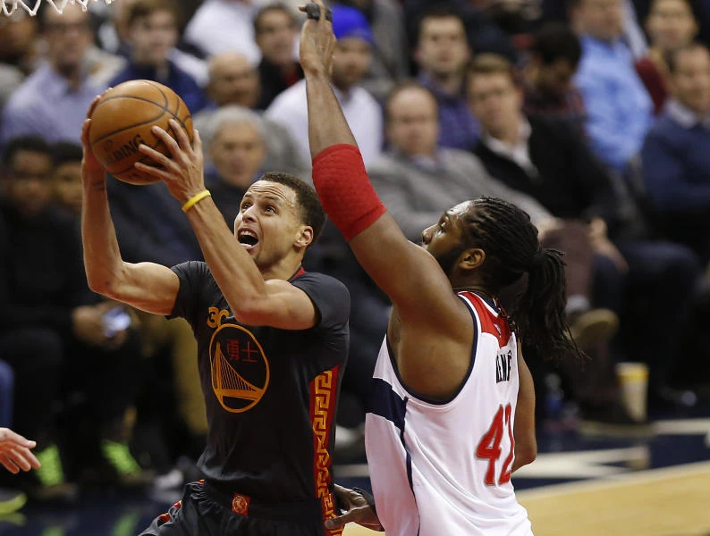 Returning Curry leads Warriors past Wizards