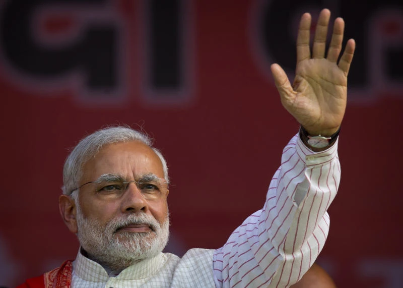 Modi seeks humble, tolerant new image after poll rout