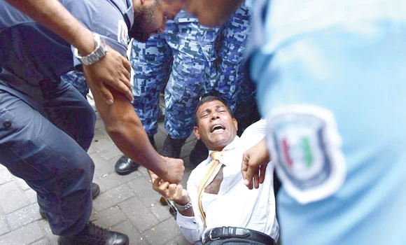 Former Maldives president dragged into court by police