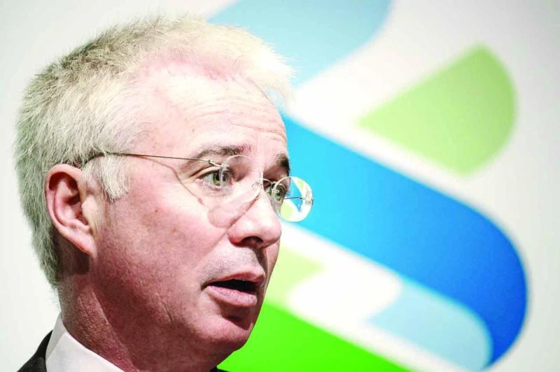 Standard Chartered net profit falls 37%