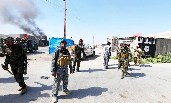 Iraqi troops, militia retake strategic town from IS