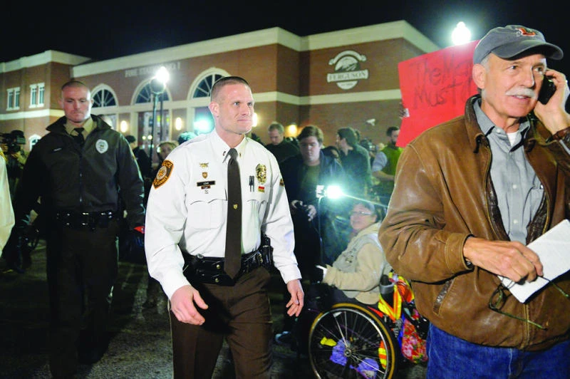Calm prevails in Ferguson after shooting of police officers