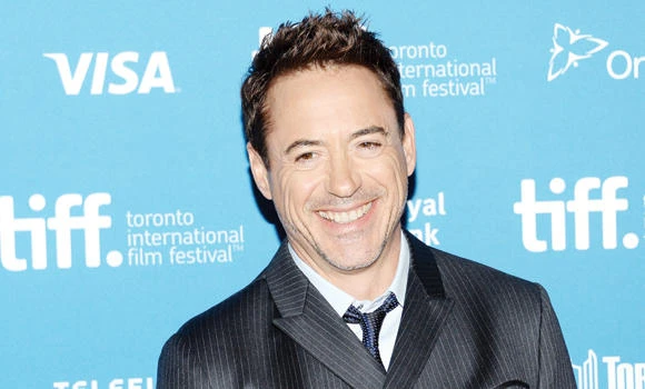 Downey presents boy with bionic arm