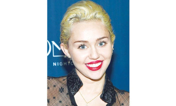 Miley makes wisdom tooth necklace