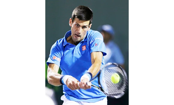 Djokovic, Serena clinch openers in contrasting style