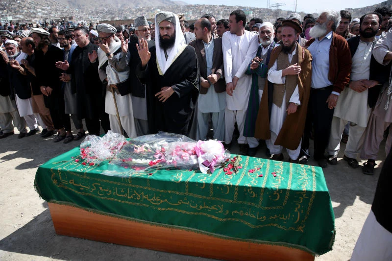 Afghanistan buries woman beaten to death by mob