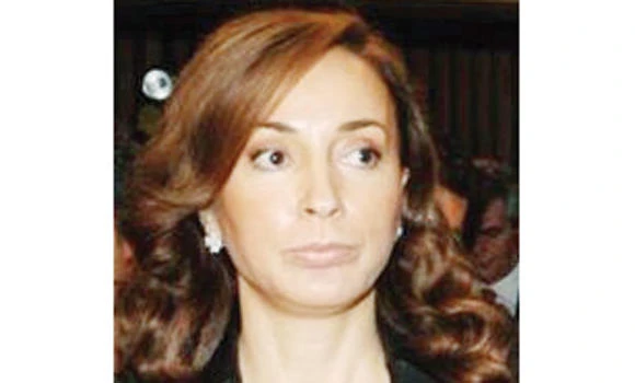 Wife of Greek ex-defense minister on the run
