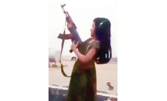 Outrage as father lets 8-year-old daughter fire machine gun