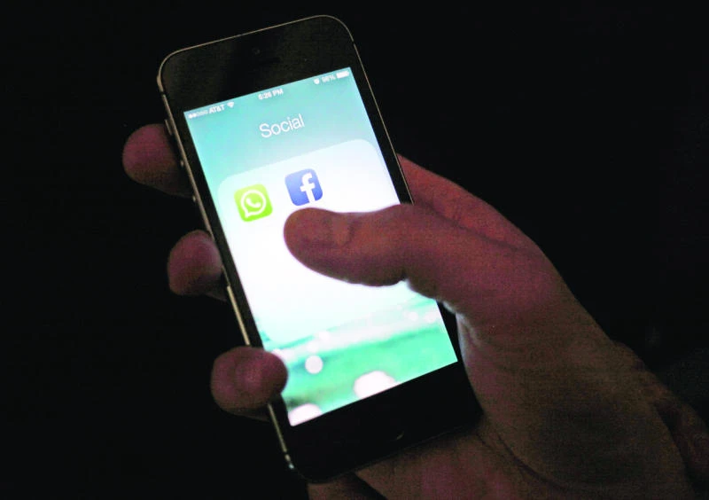 Facebook profit down but revenues, user base grow