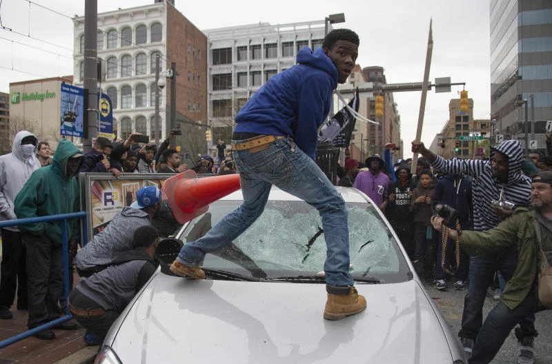 Violence mars Baltimore protest over police custody death