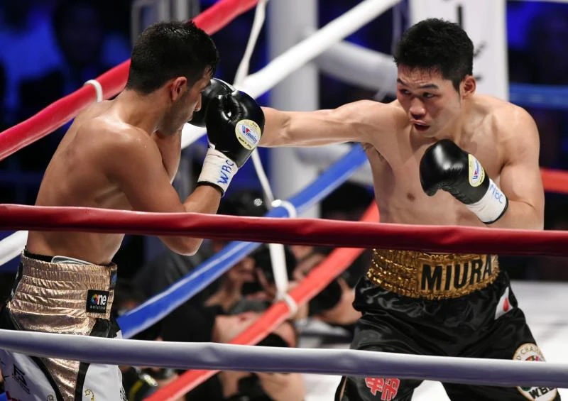 Japan's Miura flattens Dib to retain world title