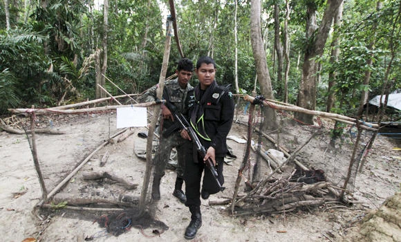Over 50 Thai cops punished over human trafficking links