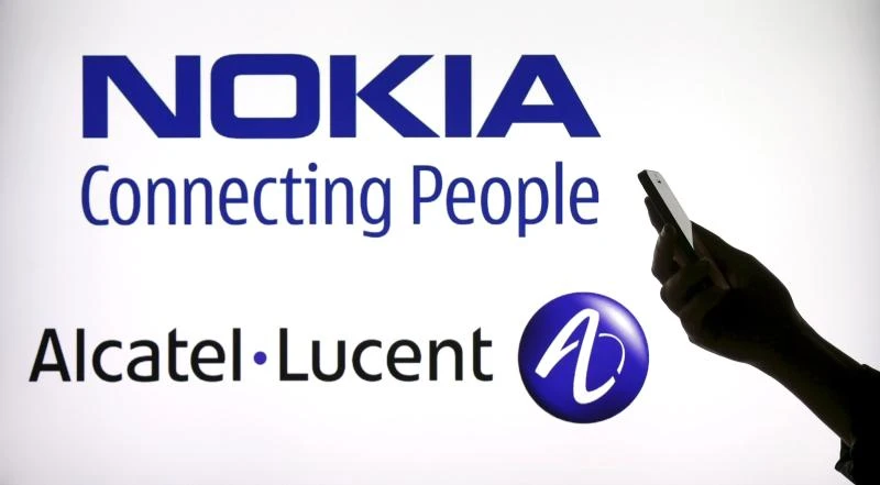 Alcatel-Lucent weathers US slowdown, defends Nokia deal