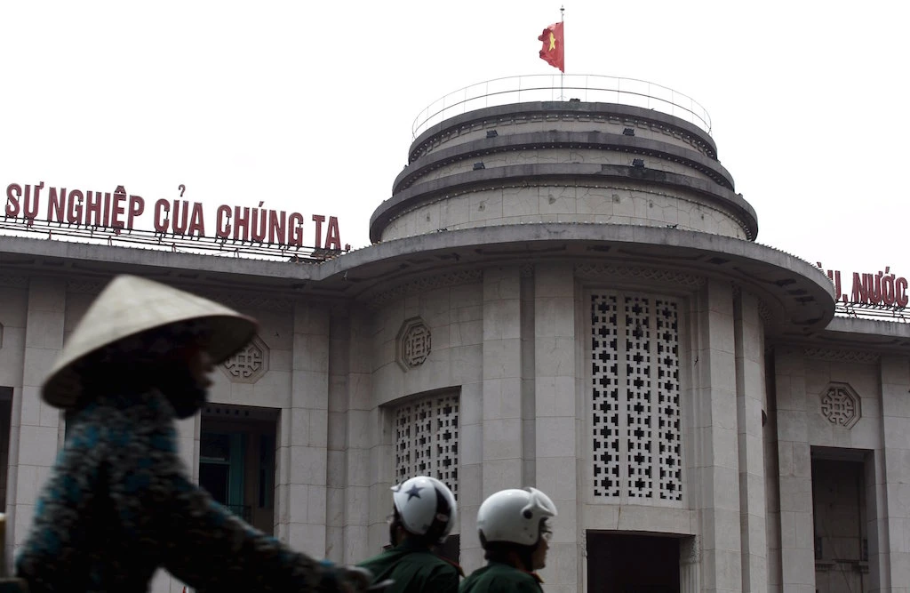 Vietnam devalues currency to boost growth
