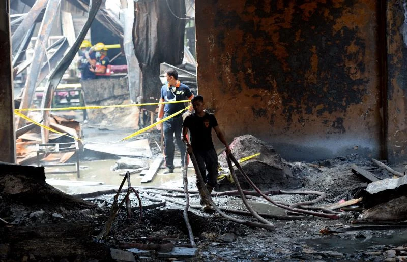 Philippine factory fire kills 72, barred windows blamed