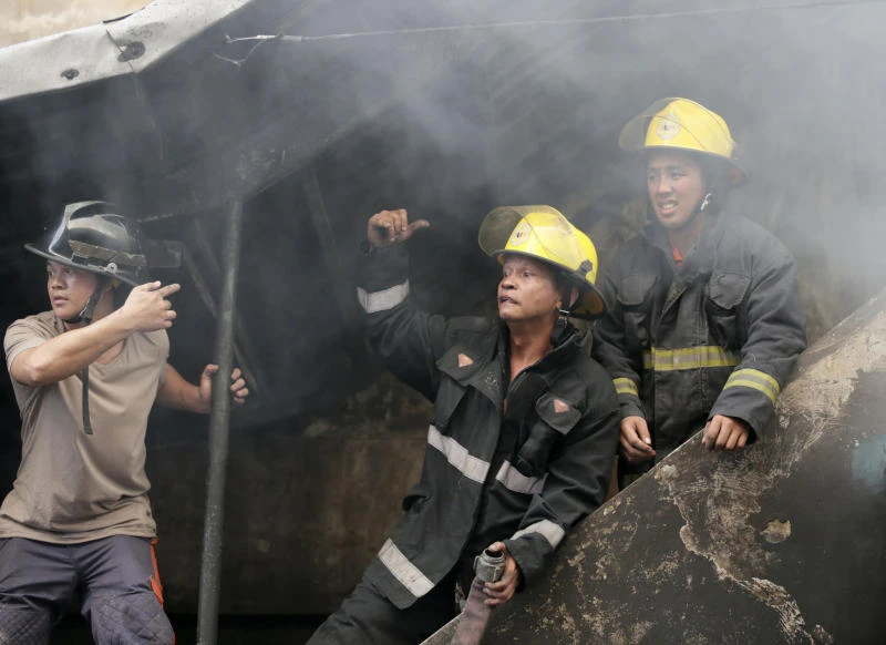 Philippine factory where 72 died suspected of breaking law