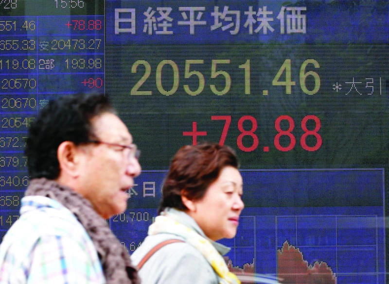 Nikkei posts 11th straight gain but Shanghai extends losses